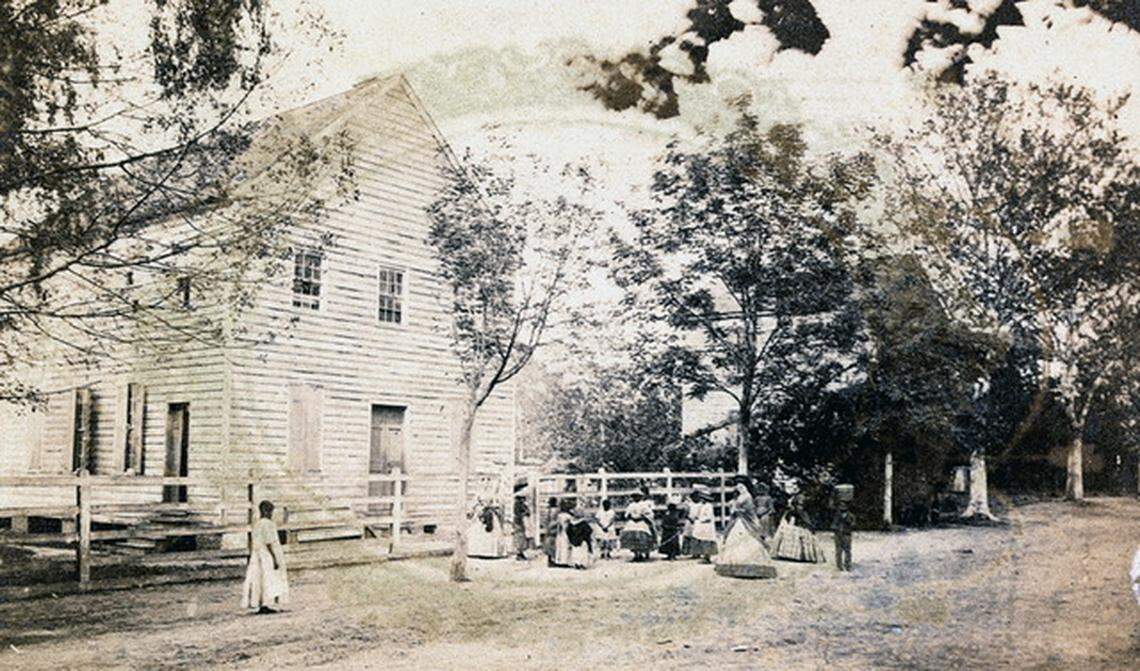 An early photo of the Tabernacle Baptist Church shows children and a few adults gathered outside. On Jan. 1, 1863, the day of the reading of the Emancipation Proclamation, several members gathered inside the church and drafted a resolution of appreciation to President Abraham Lincoln. The church still is in use today.