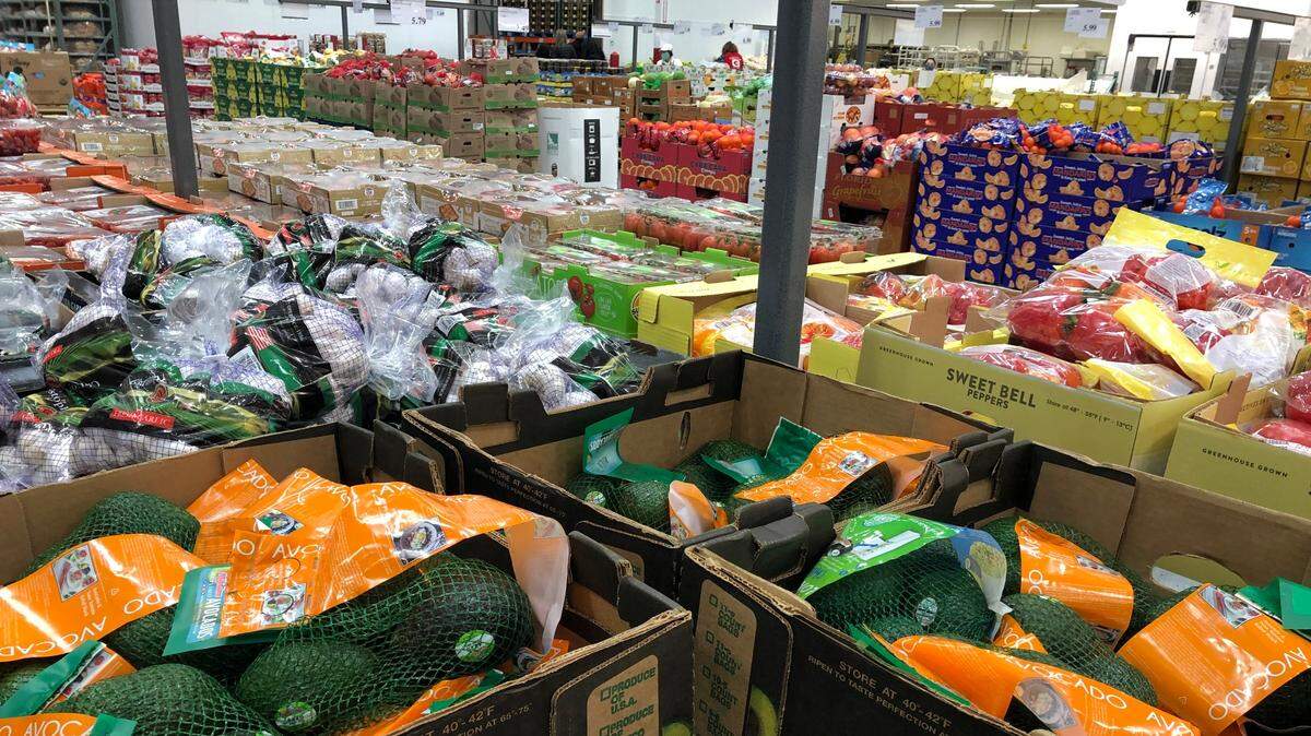 Boxes of produce are lined up for shoppers at the Costco warehouse in Charleston.