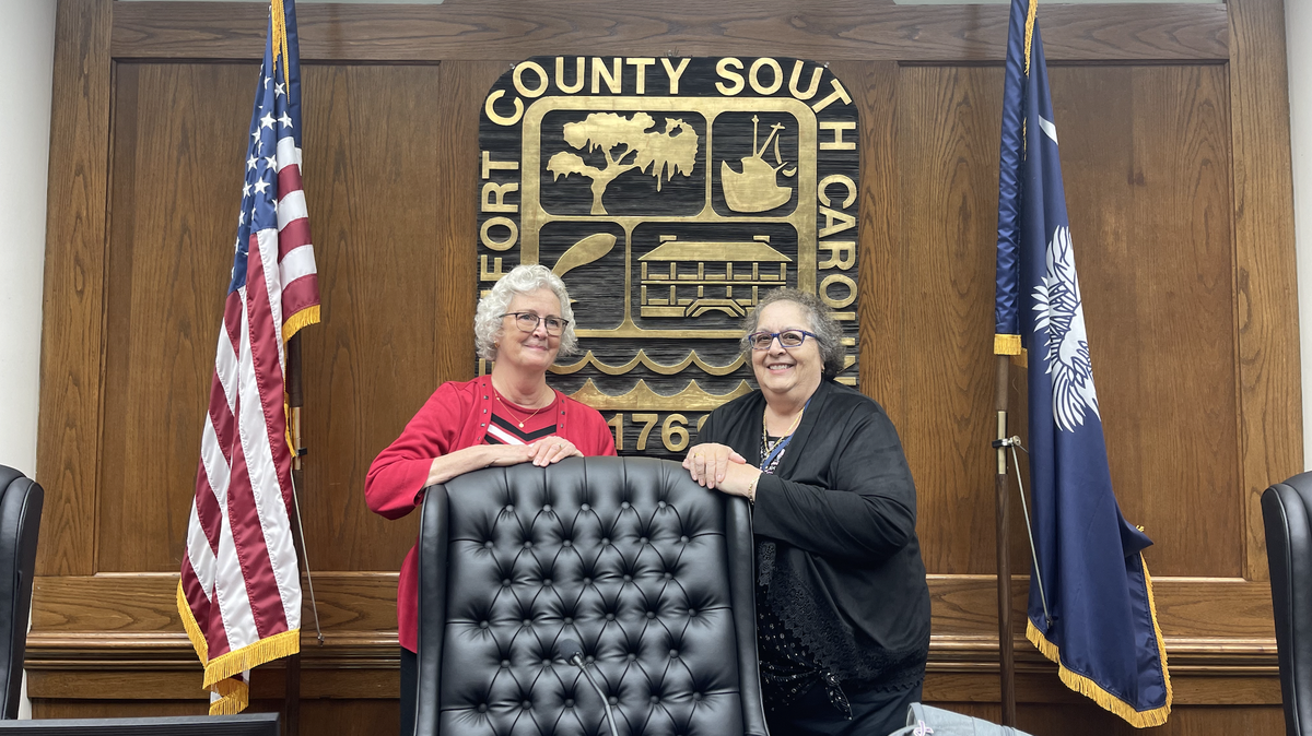 New Beaufort County Council chair Alice Howard, left, and vice chair Tab Tabernik pose in council chambers before the county seal after being elected to their positions on Jan. 2, 2025.