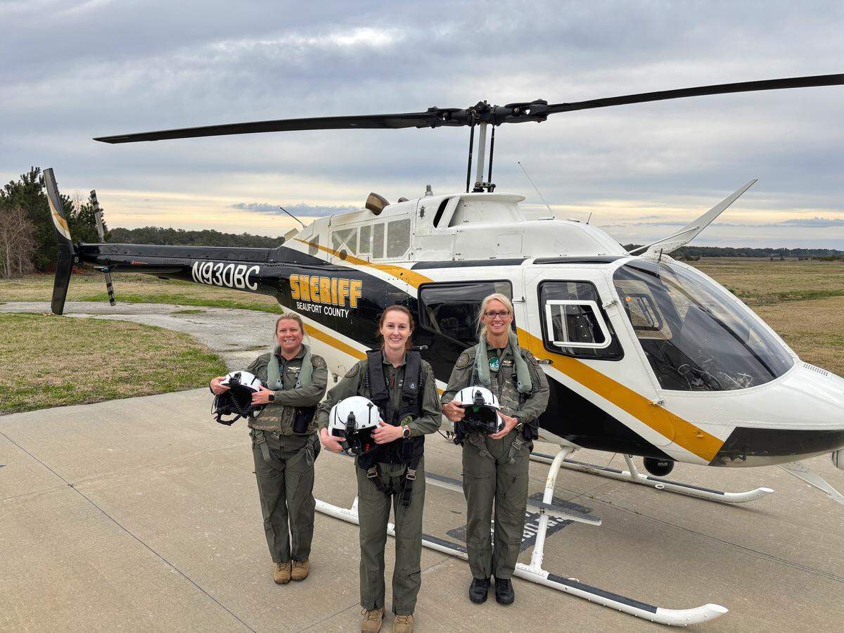 A photo shared in March 2025 shows three tactical flight officers from the Beaufort County Sheriff’s Office in front of one of the department’s two Bell OH-58 helicopters. The aircraft were provided to police by the Department of Defense’s 1033 program, which allows military equipment to be shared with state and local law enforcement.