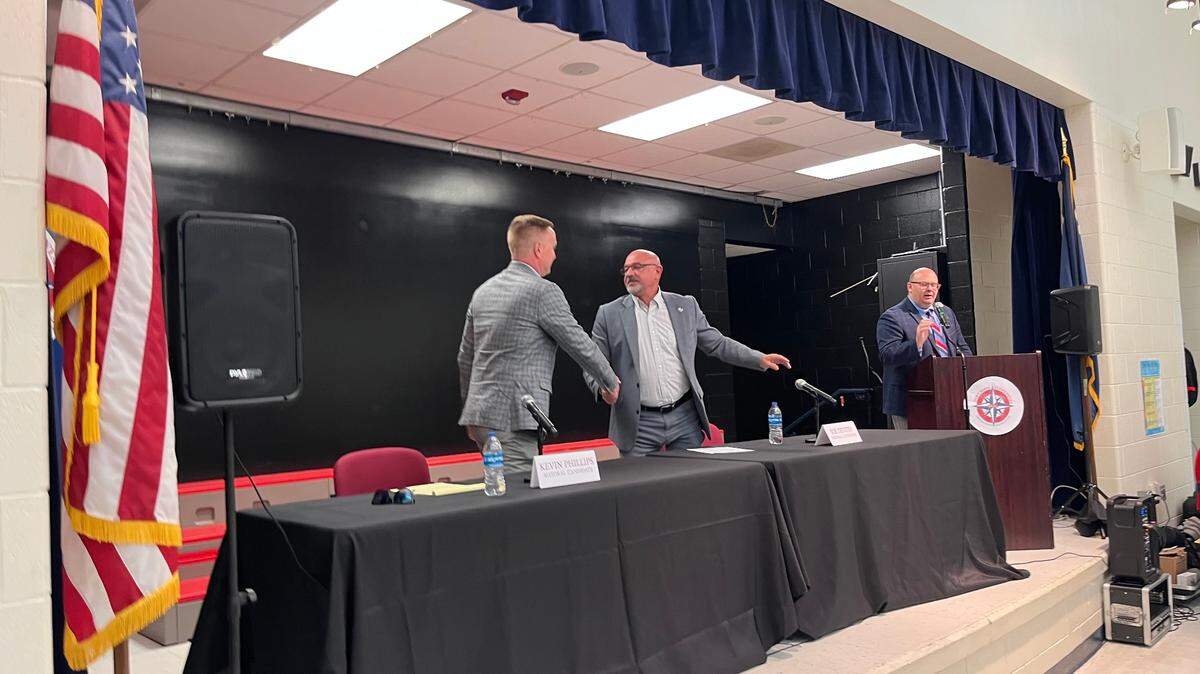 Kevin Phillips and Joe DeVito, candidates for Port Royal mayor, shake hands following a candidates forum Tuesday.