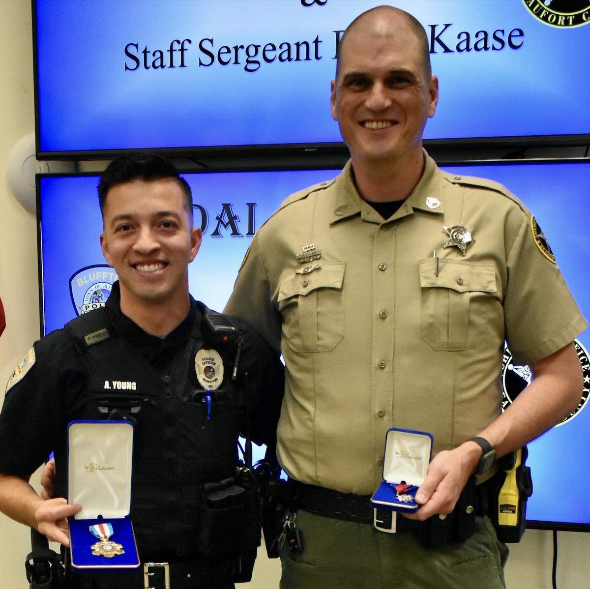 Officer Azahel Young of the Bluffton Police Department (left) and Staff Sgt. Brian Kaase of the Beaufort County Sheriff’s Office were honored Wednesday, Sept. 25, 2024 for rescuing a passenger stuck in a burning vehicle after a crash on May River Road earlier that week.