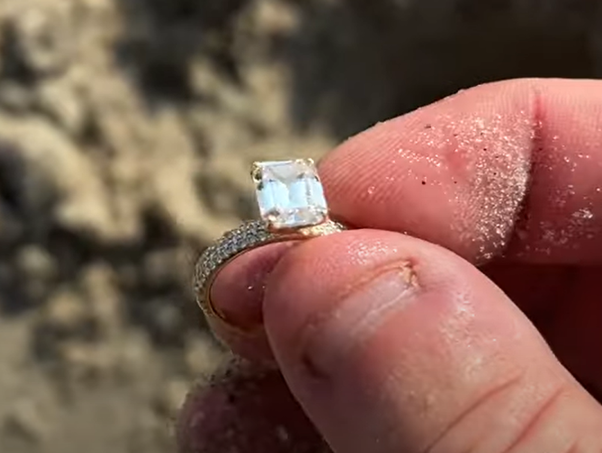 A screenshot of a YouTube video shows the wedding ring found by Georgia resident Moye Howard on Hilton Head’s Folly Field Beach. Howard uses metal detecting equipment to reunite locals and tourists with missing jewelry.