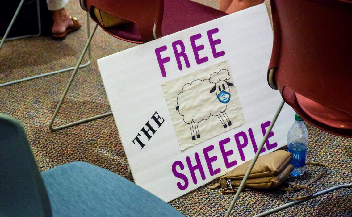 A sign reading “FREE THE SHEEPLE” is placed on the floor at Hilton Head Island Town Hall during a meeting on Aug. 17, 2021.
