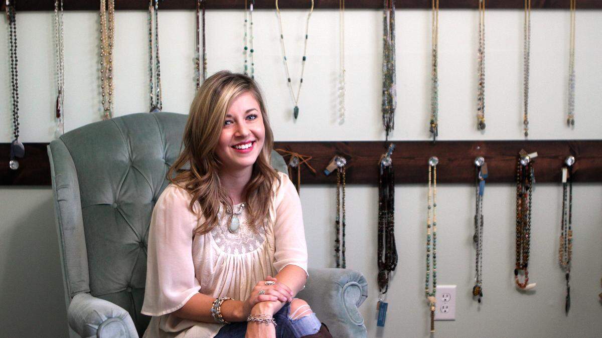 Kayla Derrick, owner and designer for circa1910 jewelry, sits for a portrait in her studio on Wednesday afternoon in Beaufort.