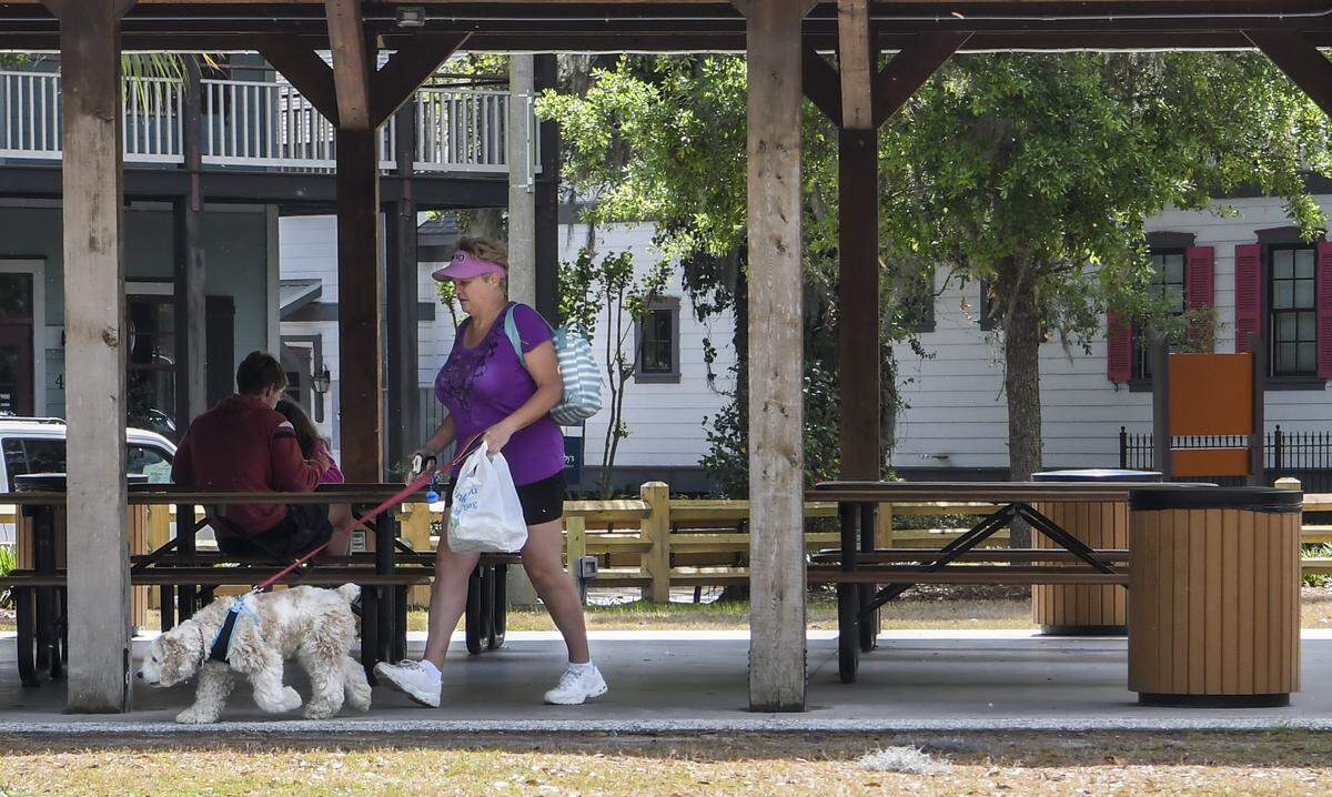 After the Town of Bluffton closed all parks, playgrounds, lots and public docks and landings at 7 a.m. on Wednesday, April 1, 2020, due to S.C. Gov. Henry McMaster’s executive order to stem the spread of the coronavirus, people gather in Dubois Park in Old Town Bluffton for lunch. When casually asked if the town closed the park, an individual responded, “There are no signs.” and then finished by saying “The police just drove by and didn’t say anything.”