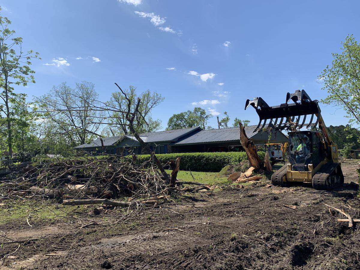 Volunteers used large machinery to clear debris and trees from around a home near Varnville on Tuesday, April 14, 2020, a day after a tornado swept through Hampton County killing five people and destroying multiple homes.