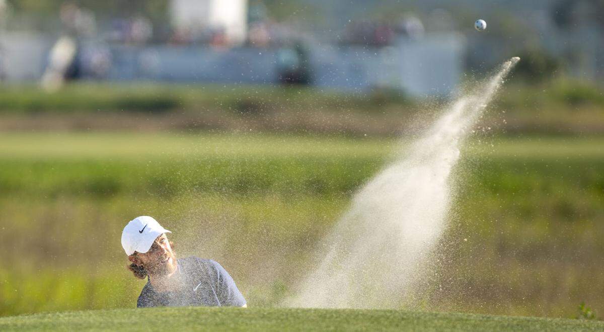 Tommy Fleetwood watches his ball fly out of the sand trap along the green on the 18th hole during the second round of the RBC Heritage Presented by Boeing at Harbour Town Golf Links on Friday, April 19, 2024 in Sea Pines on Hilton Head Island. A major restoration of the course will occur between May and November of 2025.