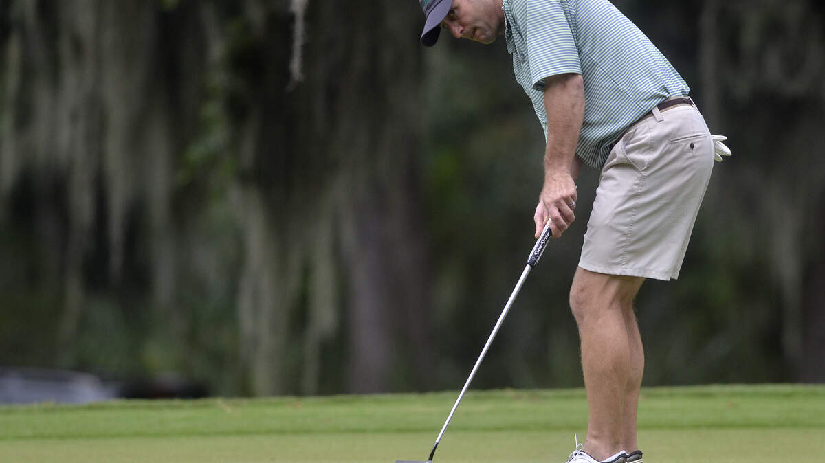 Rob Simmons putts his ball at No. 18 on Sunday afternoon during the final round of the Beaufort City Championship golf tournament at the Sanctuary Golf Club at Cat Island.