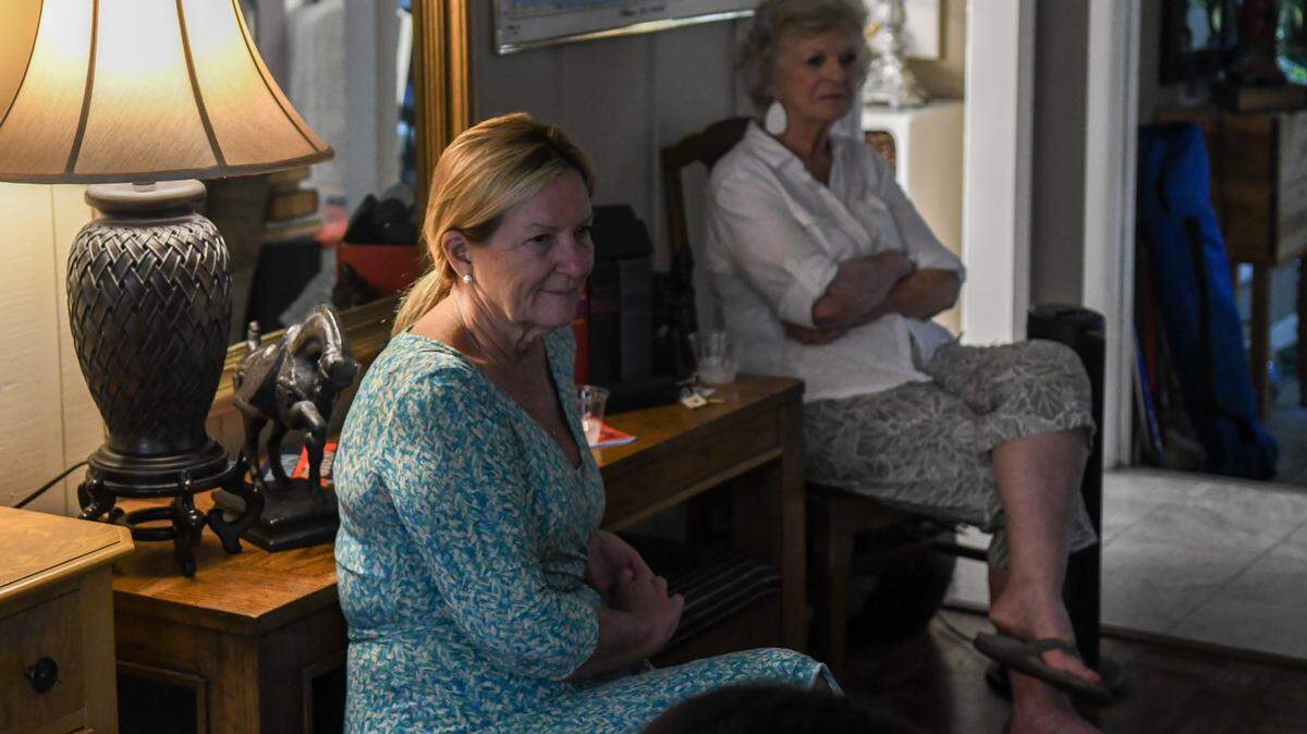 Tamara Becker, left, Hilton Head Town Council Member of Ward 4, listens along with Holiday Homes neighborhood homeowner Margie Tolly, as several neighbors talk on July 29, 2025, about the fears they have with the new construction that will likely become short term rentals.