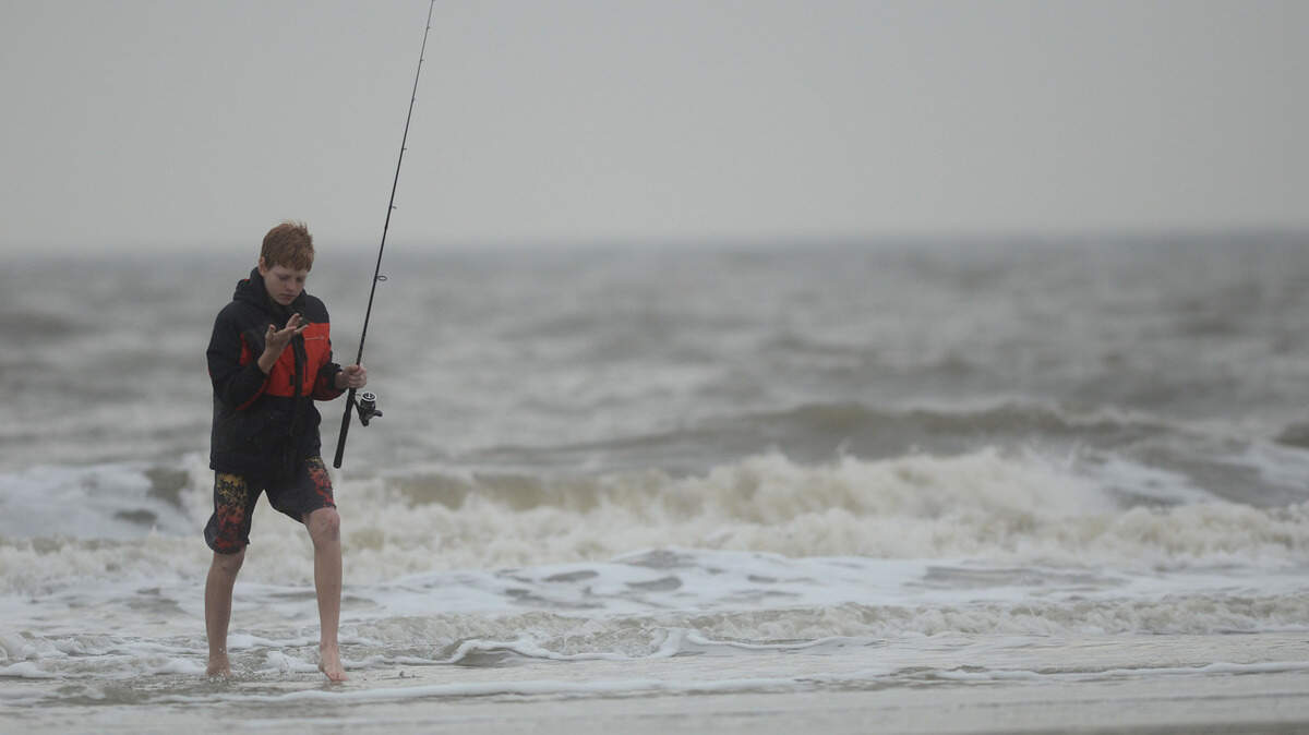 Photos of beach-goers at Coligny Beach on Wednesday, Dec. 23, 2015 on Hilton Head Island.