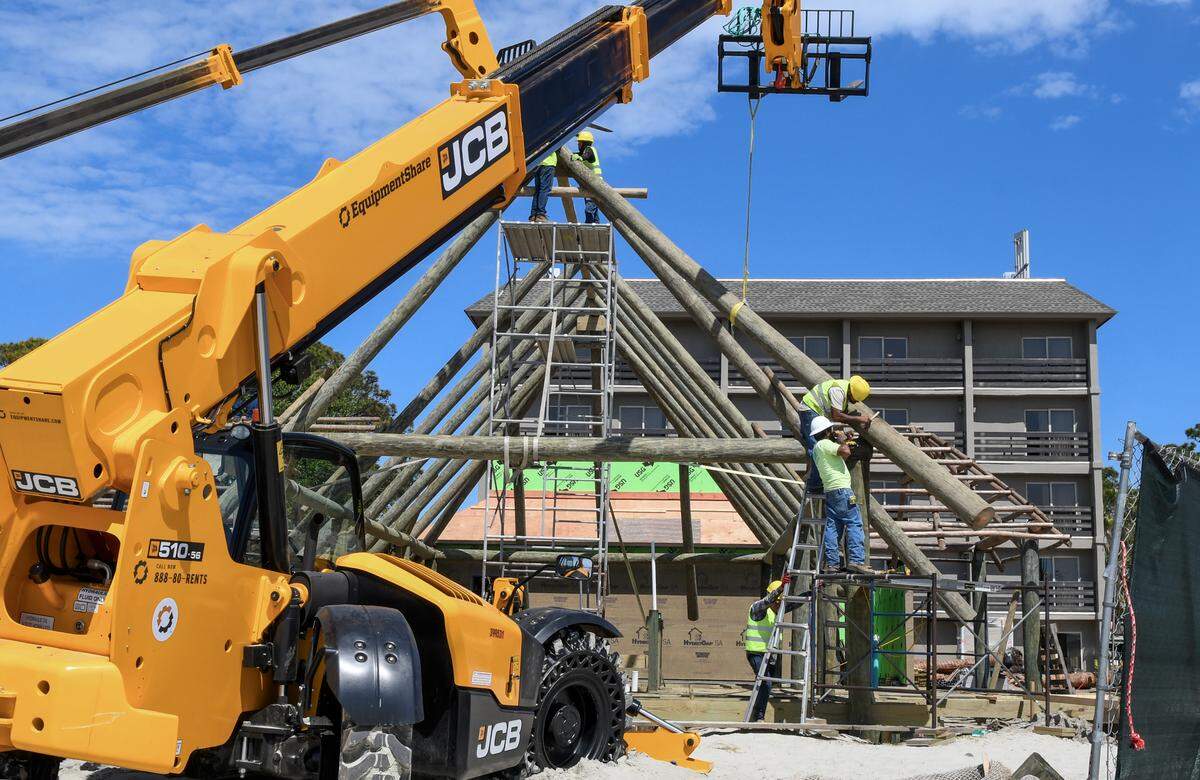 Workers attach beams to the completely reimagined Tiki Hut, a companion to the Beach House Hilton Head Island near Hilton Head’s Coligny Beach Park. The Tiki Hut will offer full bar service; a larger, live band stage; restrooms and outdoor curtains that can protect customers from wind and rain.