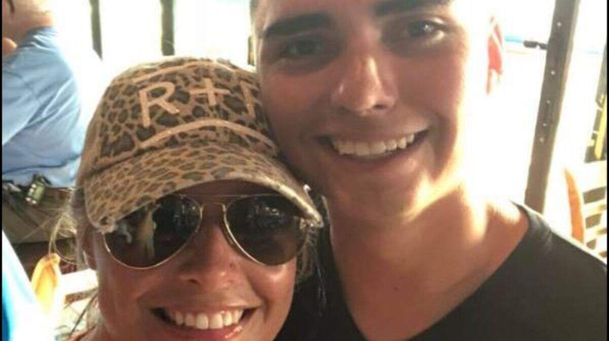 Suzanne Rogers poses with Jaime Andrade after returning a lost Marine Corps ring to him that she found on Sunday, July 22, 2018, in Siesta Key, Florida.