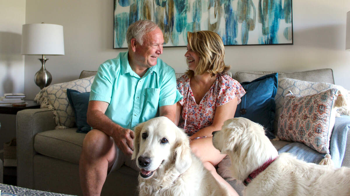 David and Lori Trapani grin at each other at their home in Hilton Head Plantation, where they live with their dogs Happy and Pippa. The pair have both lost former spouses to cancer, and grew close through their shared grief.