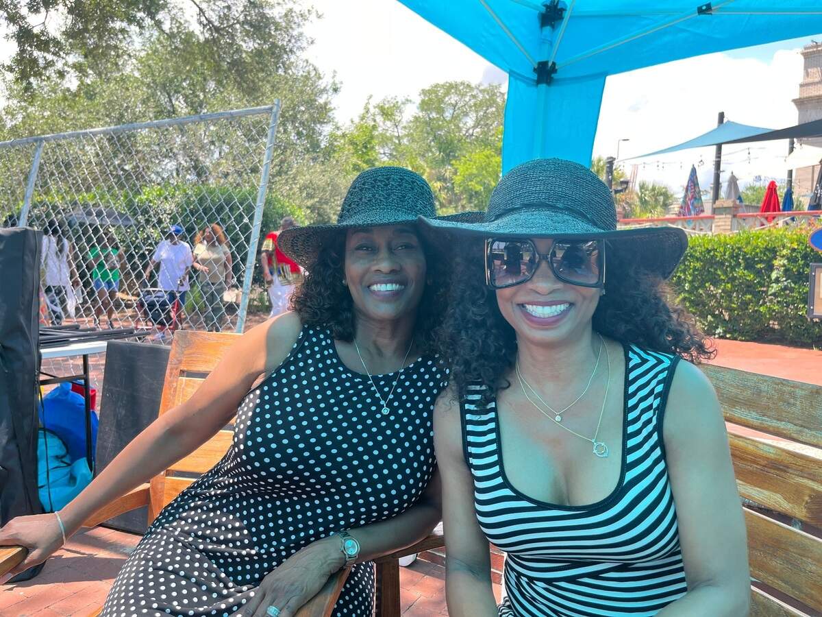 Teresa Davis of Atlanta and Violet Seldon-Smith, CEO of Global Tax and Business Services in Sumter, attend the Original Gullah Festival in Beaufort Sunday. The company paid for its employees to attend the festival. “Learning a lot I didn’t know,” Davis said of the Gullah culture.
