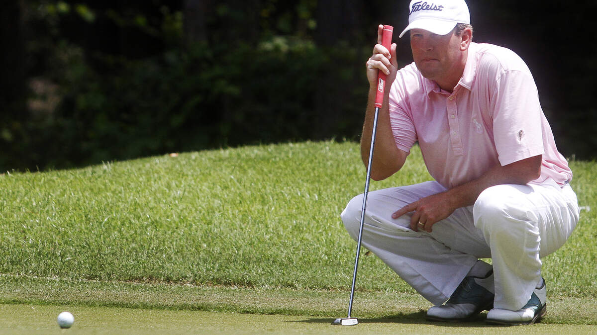 Theophil Syslo, Staff photo
John Patterson sizes up his putt while participating in the opening round of the Hilton Head Open at the Bear Creek Golf Club on August 9, 2014.