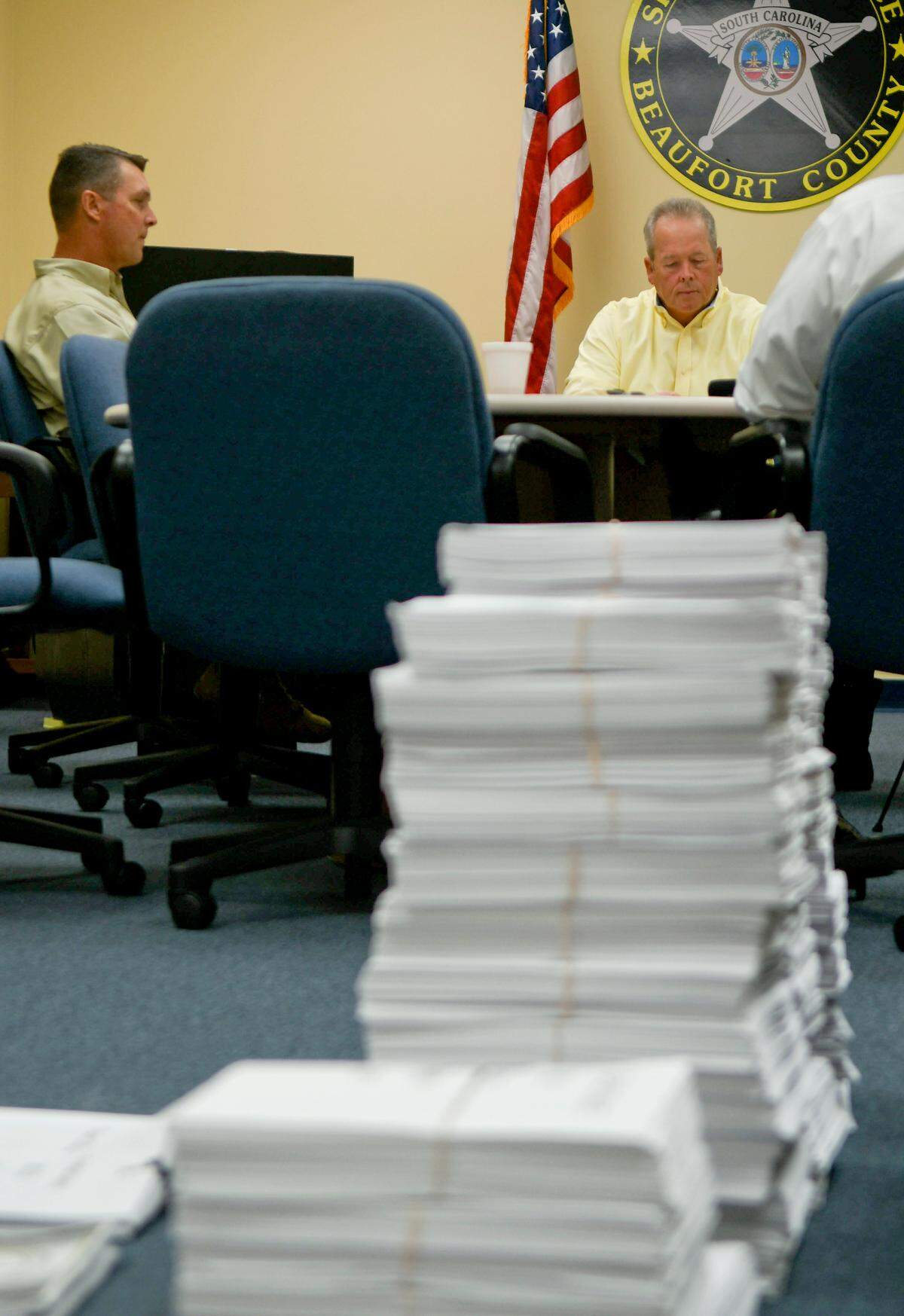 Duplicated documents on display in November 2018 to illustrate the years of data that was given to a consulting firm hired by the Town of Hilton Head Island to determine if the town was receiving enough services for what it was spending. Sheriff P.J. Tanner, center, and Col. Allen Horton, left, took issue with the group’s notation that the office was uncooperative in sharing data.