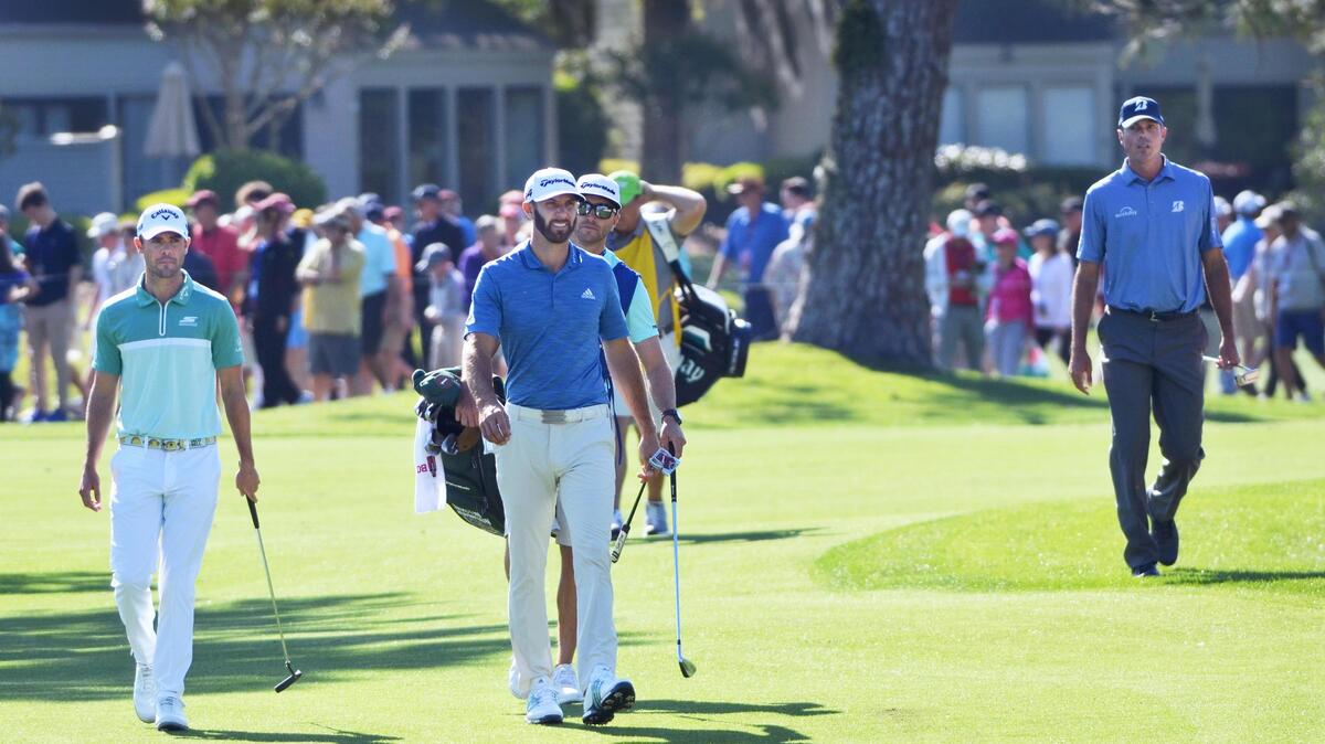 
From left, defending RBC Heritage tournament champion Wesley Bryan, No. 1 golfer in the world Dustin Johnson, and 2014 tournament champion Matt Kuchar march down the 16th fairway accompanied by a large gallery during Thursday's first round of the RBC Heritage Presented by Boeing golf tournament at Hilton Head Island's Harbour Town Golf Links.
