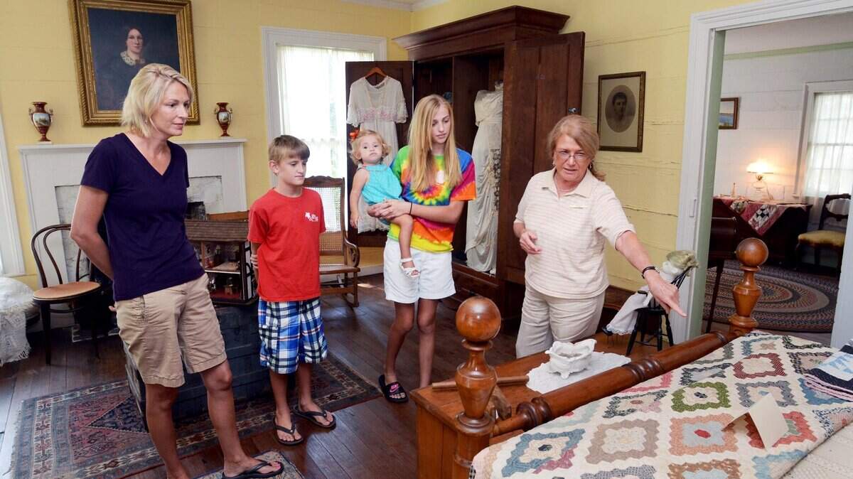 File: Heyward House Historic Center docent Sonie Phinney-Miller, right, gives a tour of the historic Bluffton house Sept. 16, 2013, to Joy Tinney, of Bloomingdale, Ga., and Tinney's children, from left, Luke, 11, Caroline, 1, and Kate, 12.