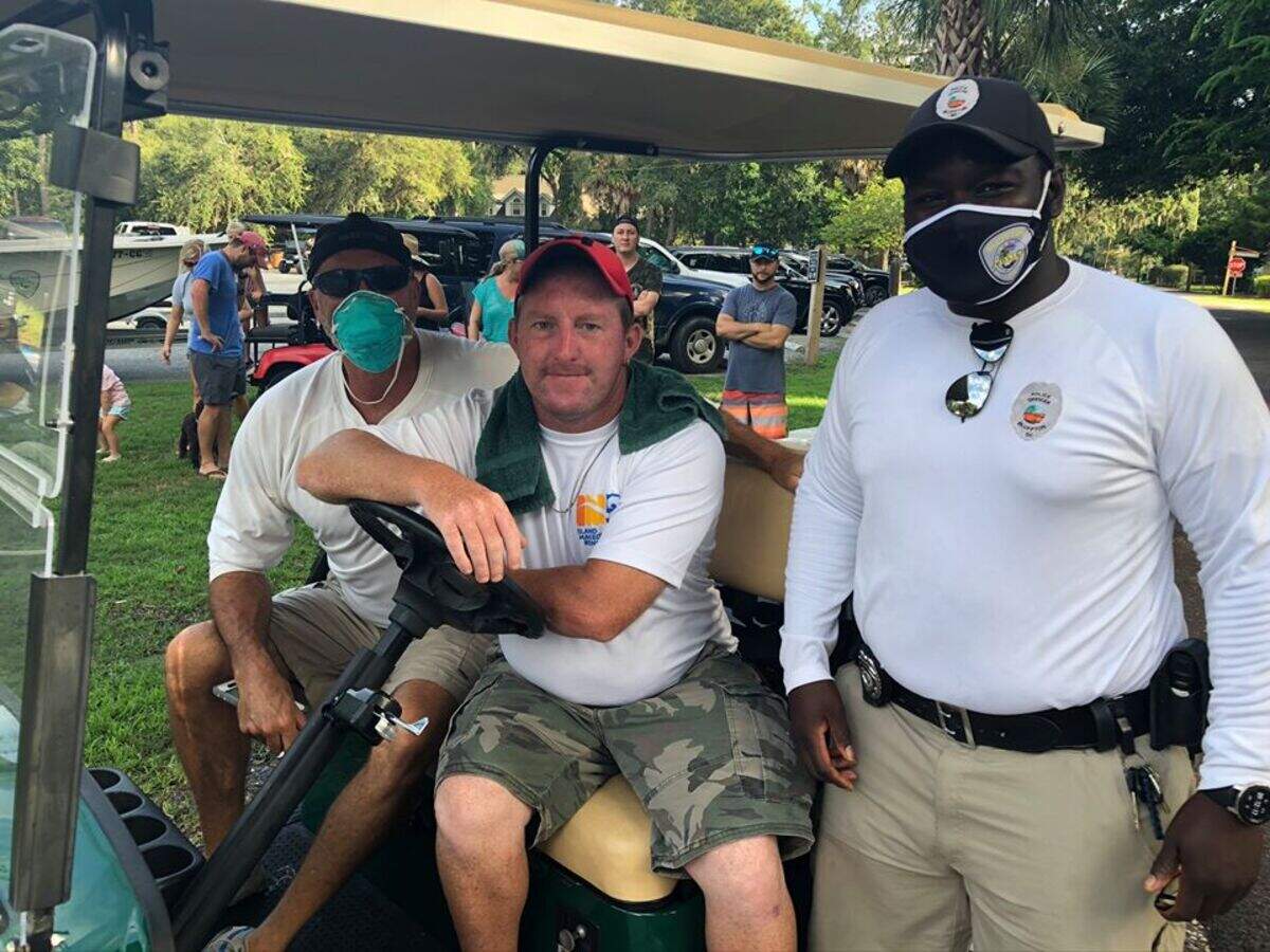 Jeffrey Gainey is gifted a golf cart following a community fundraiser. Gainey, 35, helps the Old Oyster Factory Park boat launch run smoothly on busy summer days.