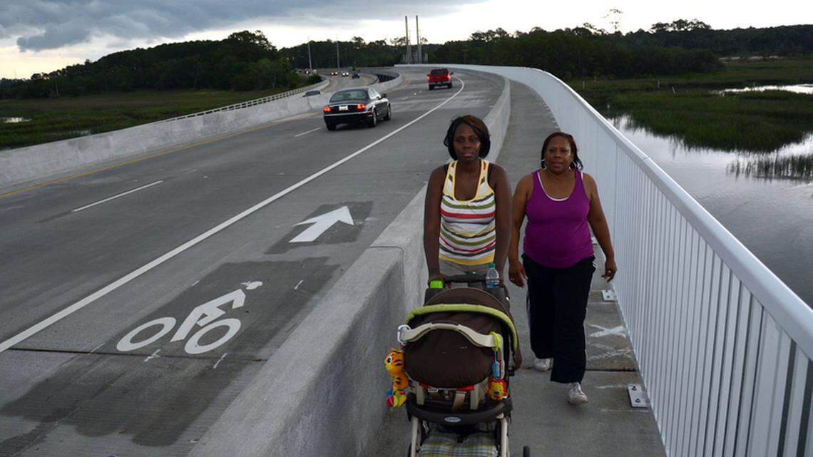 Beaufort's Suzette Fields, left, and Felecia Higginbottom walk up the J.E. McTeer Bridge on May 17 on Lady's Island. 