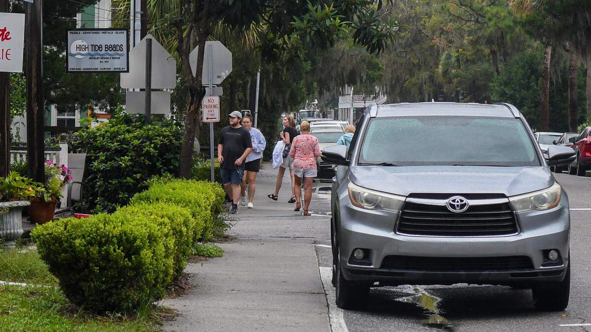 A handful of people milled about along Calhoun Street in Old Town Bluffton on Thursday, Sept. 26, 2024, during a lull in the weather as Hurricane Helene began getting closer to making landfall in Florida.