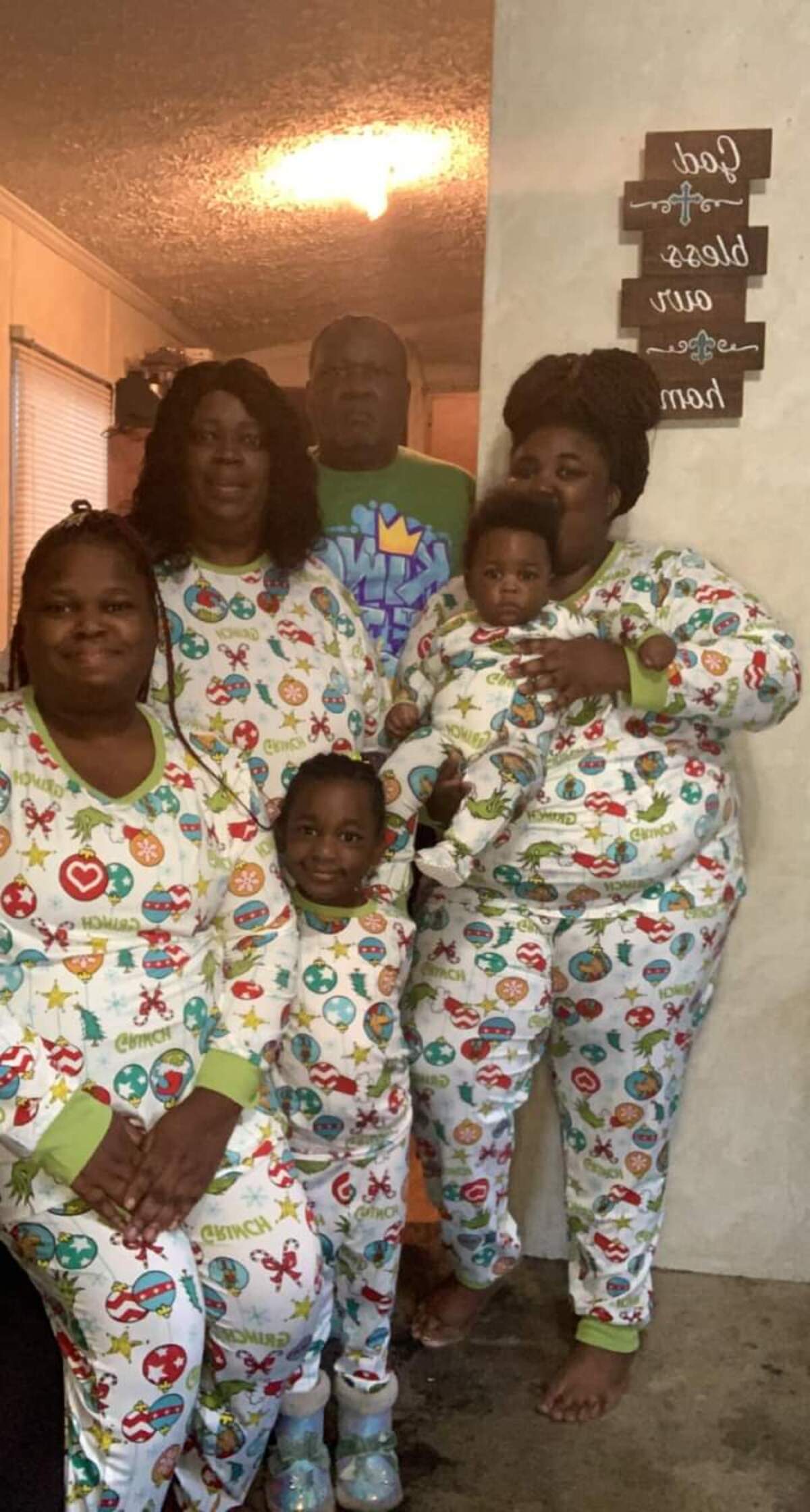 Ellis Davis, his wife Lisa, their daughters, Sherrece Howard and Malysia Davis Parrish celebrate the holidays in their home of five years with grandchildren Davarius and Simone Howard.