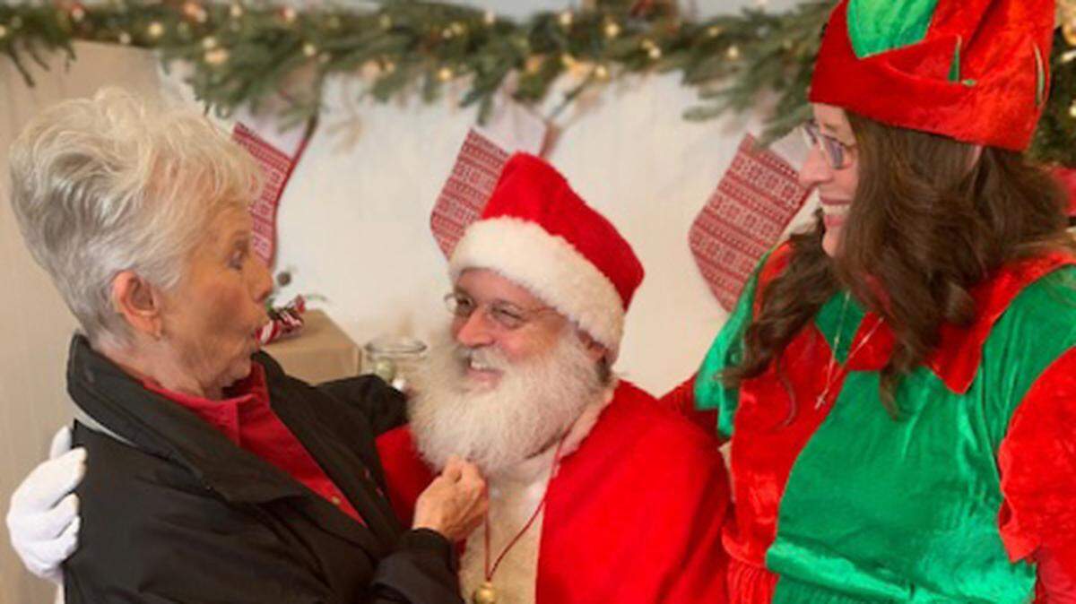 Jean Tanner shared her wish with Santa while sitting on his knee.