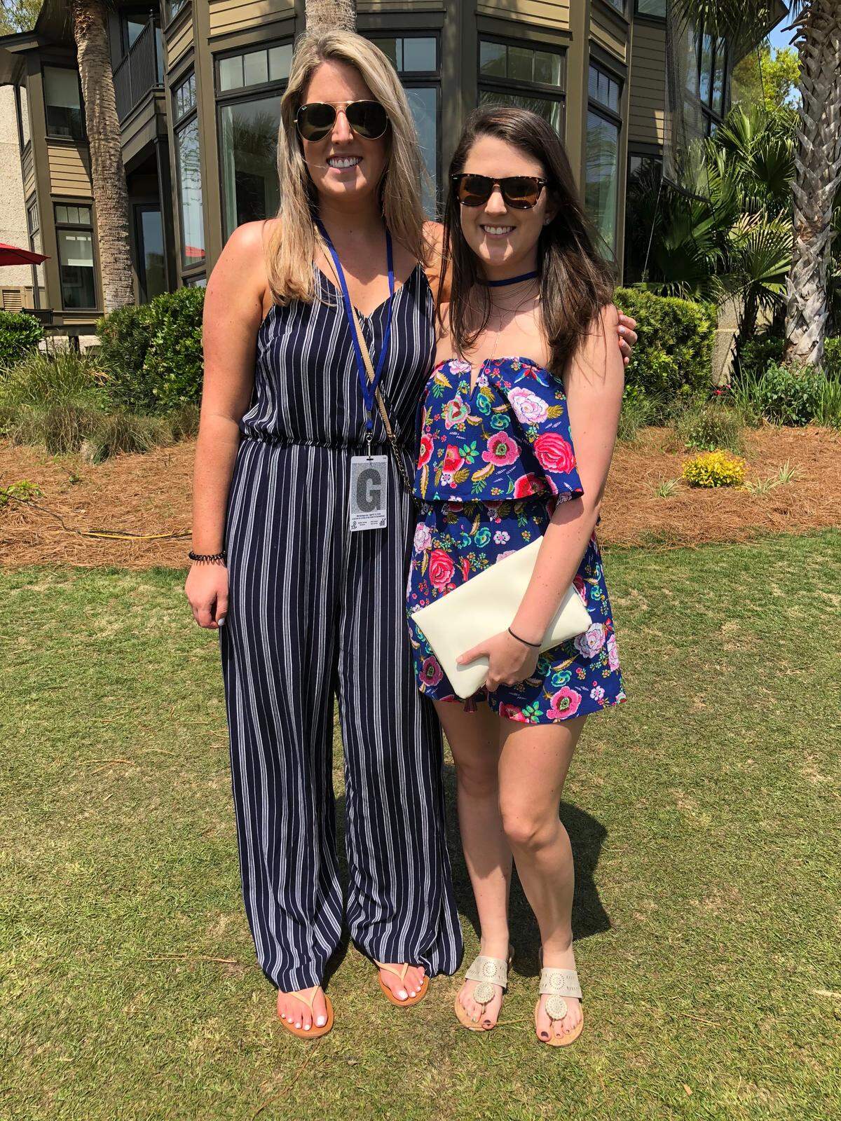 Courtney McNamara (L) and Whitley Russell prefer wearing rompers to dresses at the RBC Heritage Golf Tournament on Friday, April 13, 2018.