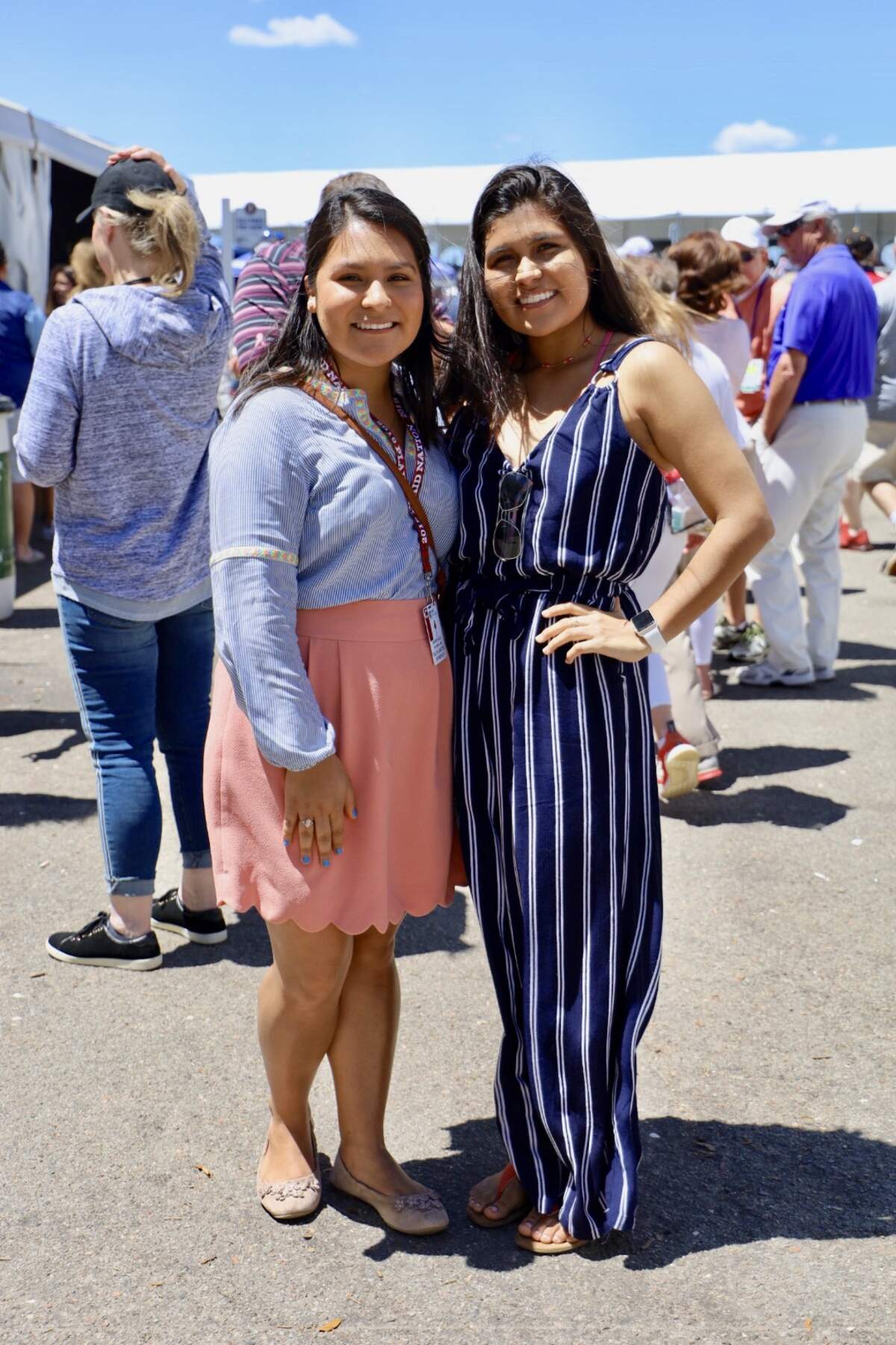 Elizabeth and Alejandra are attending Heritage today and wear outfits that perfectly compliment each other. Elizabeth’s salmon colored skirt is accented with scallop details and paired with a light blue top. Pastel colors continue to be a crowd favorite and Elizabeth’s outfit makes it easy to see why.