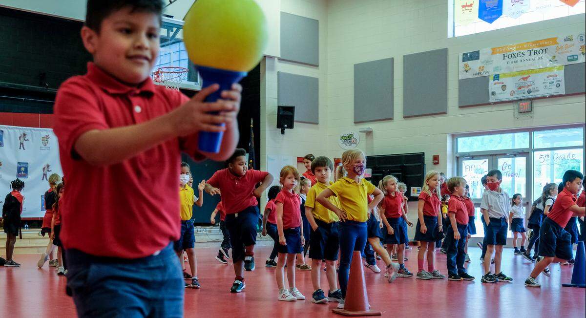 Multicultural students participate in a relay race in Bluffton, where the Hispanic population has exploded since the early 2000s.