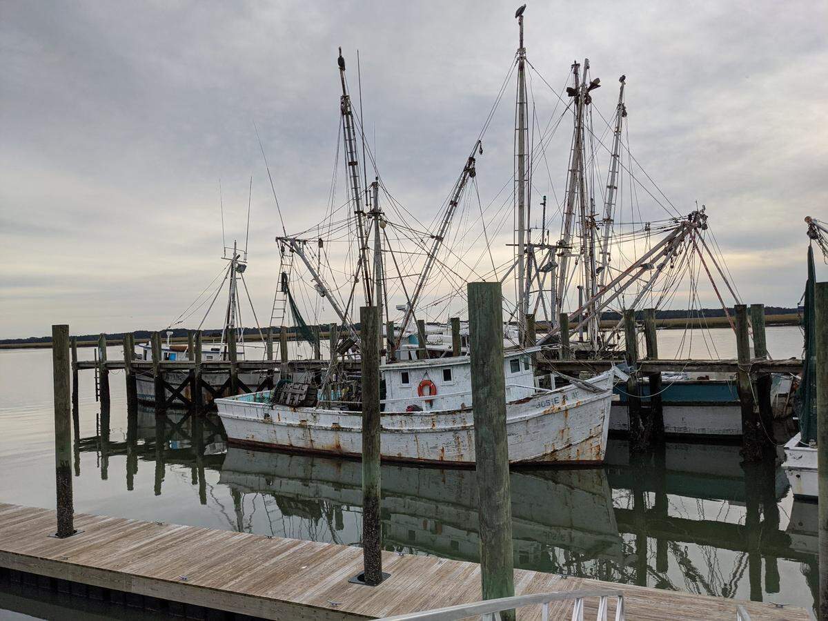 Shrimp boats sit vacant at the end of Port Royal’s publicly-operated shrimp docks on Battery Creek on Dec. 3, 2020. Several rotting boats moored at the docks are no longer seaworthy. Town officials are seeking grant money to dispose of derelict vessels that have sunk at the docks.