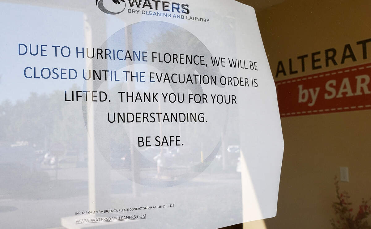 A sign on a business that closed as a result of Hurricane Florence in September