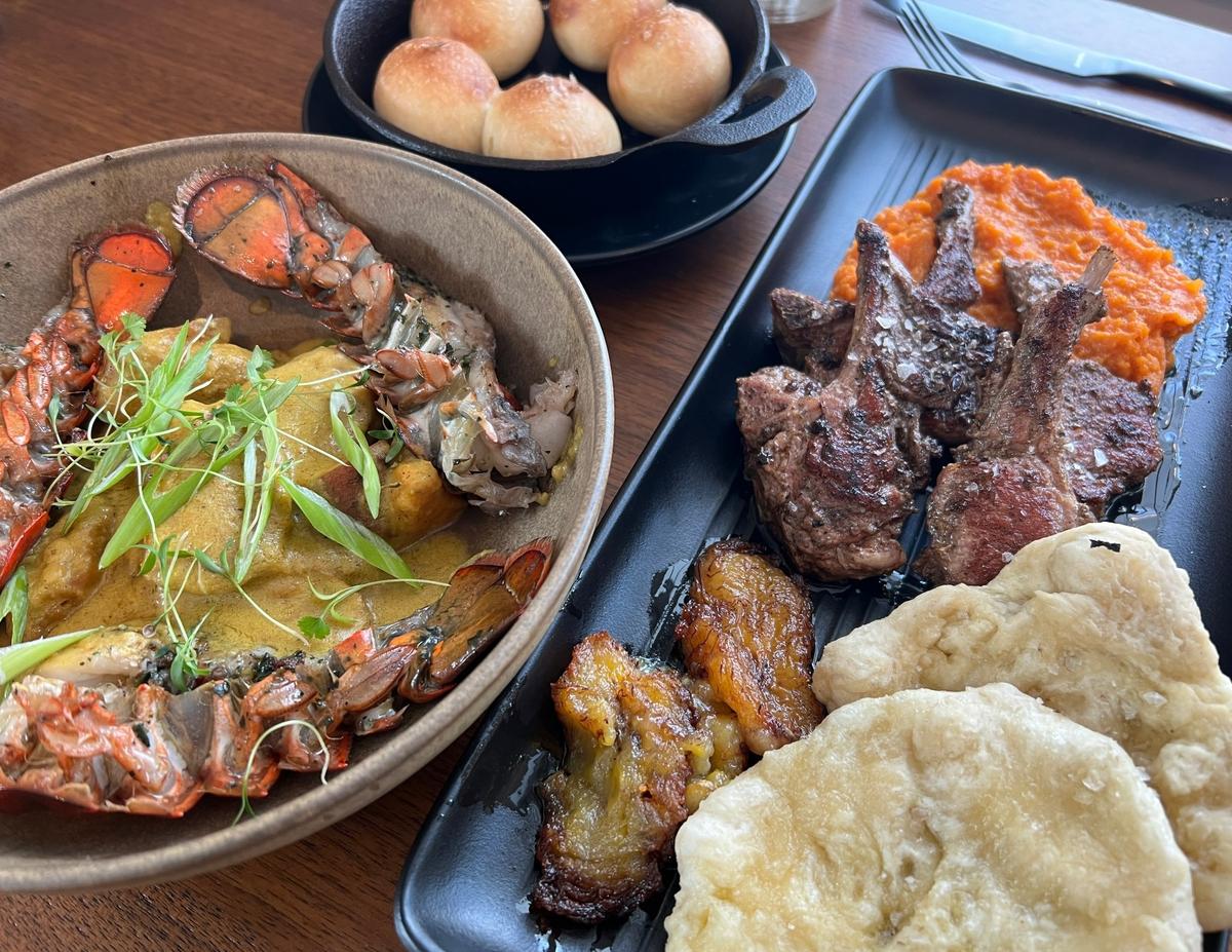 Clockwise from left: Cashew curry served with lobster, coco bread, jerk goat and bara are on the menu at Okan in Old Town Bluffton.