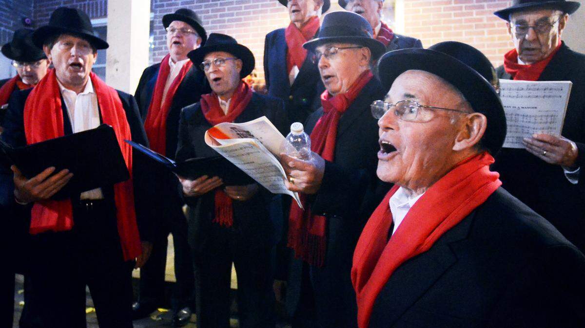 File: Hal McCann, foreground, and the rest of the Beaufort Harbormasters Lowcountry Barbershop Chorus sing carols Dec. 5, 2014, as downtown Beaufort kicked off the holiday season with its annual "A Night on the Town."