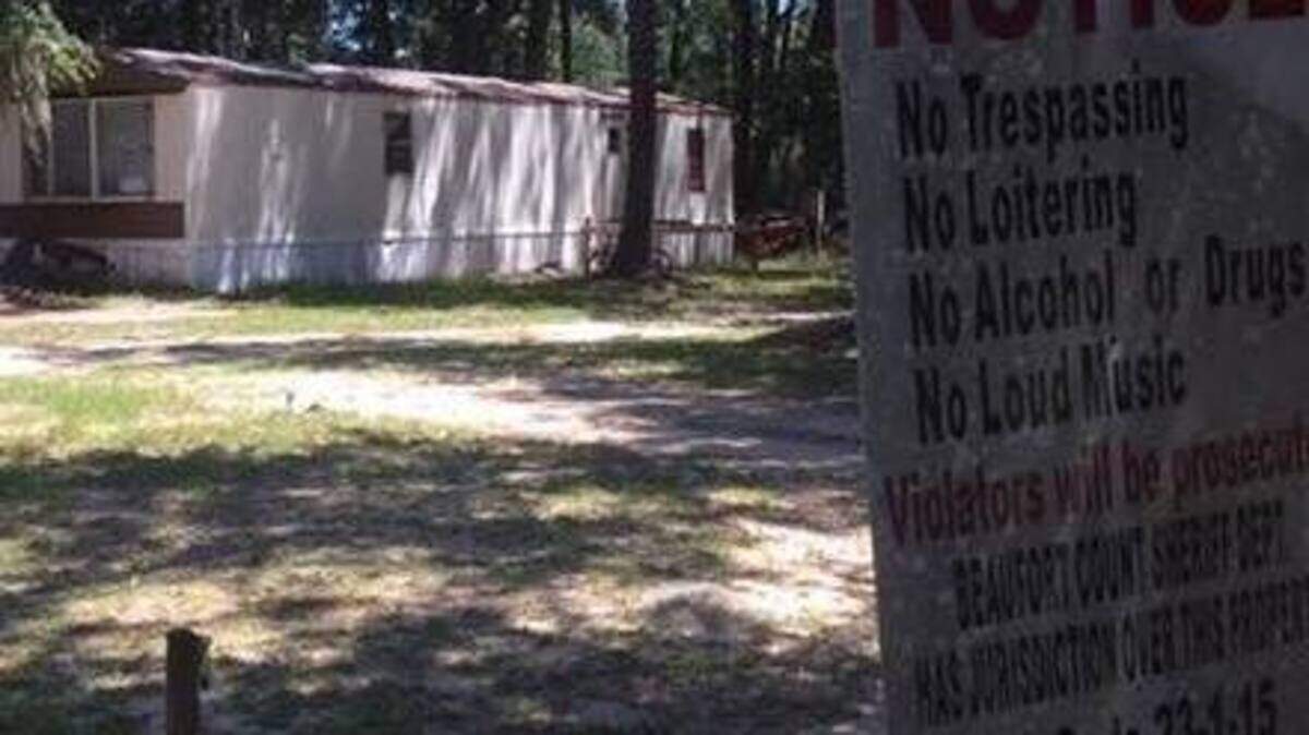 Beaufort County Sheriff’s Office deputies responded to this home on Miller Drive in Burton on Thursday after they say a man hit another man with his truck during a dispute, knocking him under an adjacent mobile home.