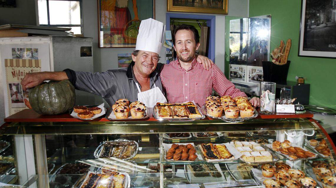 Robert Plantadis,owner of The Midnight Bakers, and his son Olivier Plantadis, stand for a portrait with some of their baked goods at The Midnight Bakers Bistro on March 5, 2015.