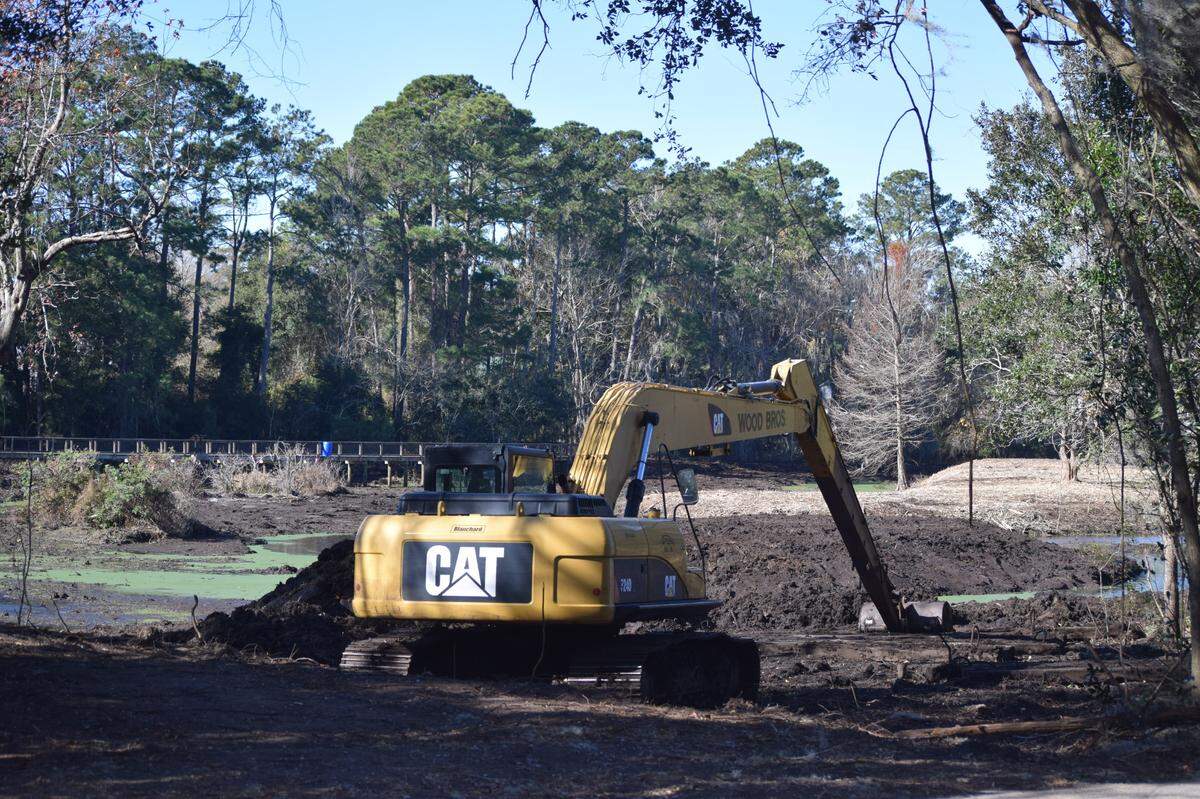 An excavator sits at the Cypress Wetlands in Port Royal on Friday, Dec. 25, 2020.