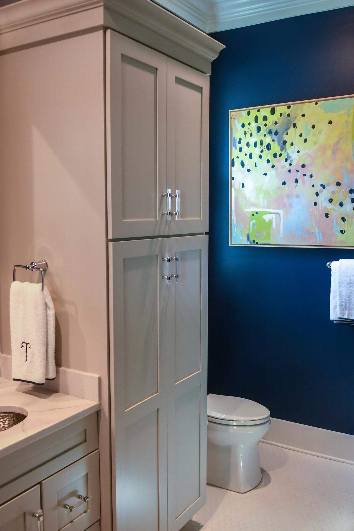 Allen Patterson Builders constructed the house that includes framing in the walls by the toilet that will accomodate grab bars if they become necessary. The vertical cabinet next to the toilet can be esily removed to make the bathroom wheelchair accessible.