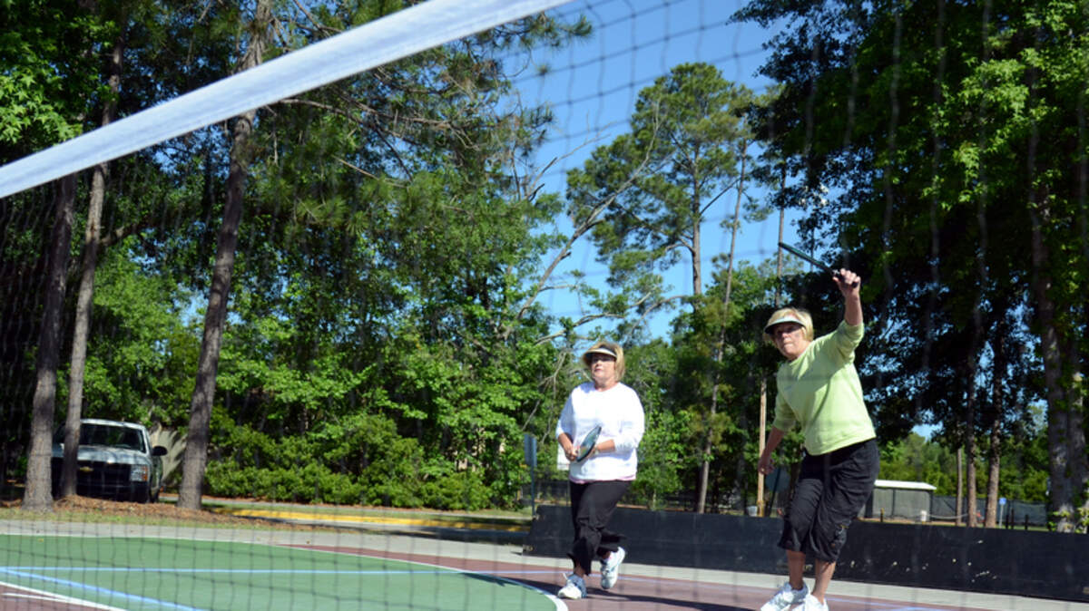 File: Jan Fraunfelder and Judy Johnson of Toledo, Ohio, play pickleball the morning of April 30, 2012, at the Island Rec Center on Hilton Head Island.
