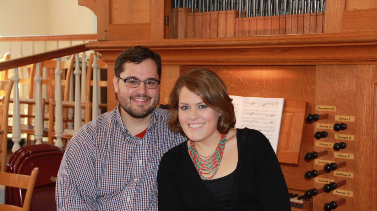 John and Sarah Stender sit at the organ at the Parish Church of St. Helena on Oct. 8, 2015.