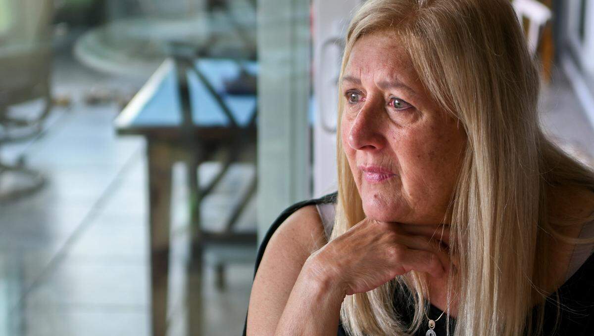 Tears fill the eyes of Laura Marks, a resident of Sun City Hilton Head, on the morning of September 20 as she recalls getting bilked out of $18,000 from a scammer who held her bank accounts hostage.