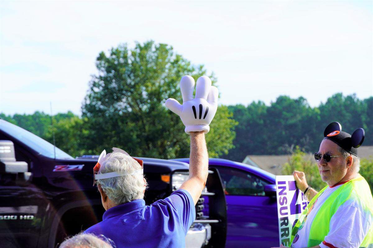 One Friday morning protester waved to passing cars with the iconic glove of Mickey Mouse. Demonstrators wore Disney gear in reference to Florida governor Ron DeSantis’ recent clash with Disney, his home state’s largest employer, over the company’s “woke” business practices.