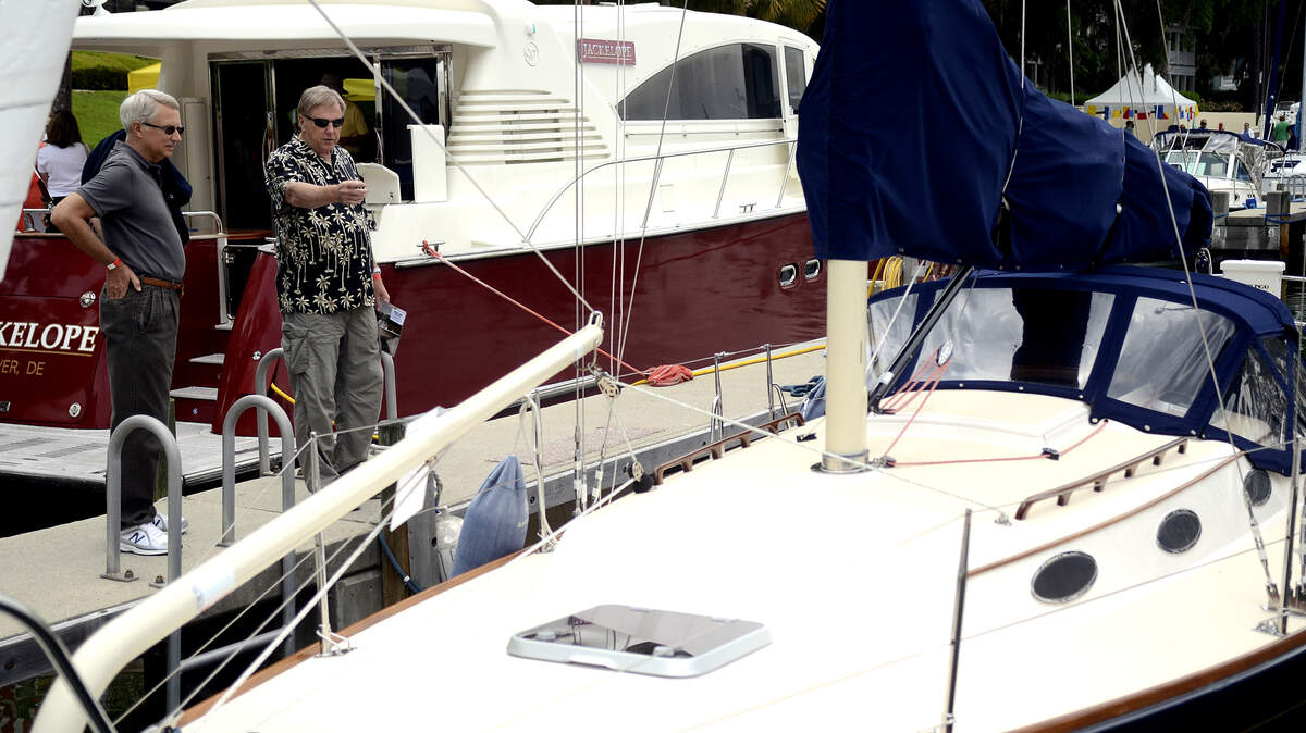 George Ferguson, left, of Hilton Head Island, and Roy Waldren, also of Hilton Head, look at one of the boats on display during the 10th annual Hilton Head Island Boat Show in May 2014 at the South Carolina Yacht Club at Windmill Harbour.