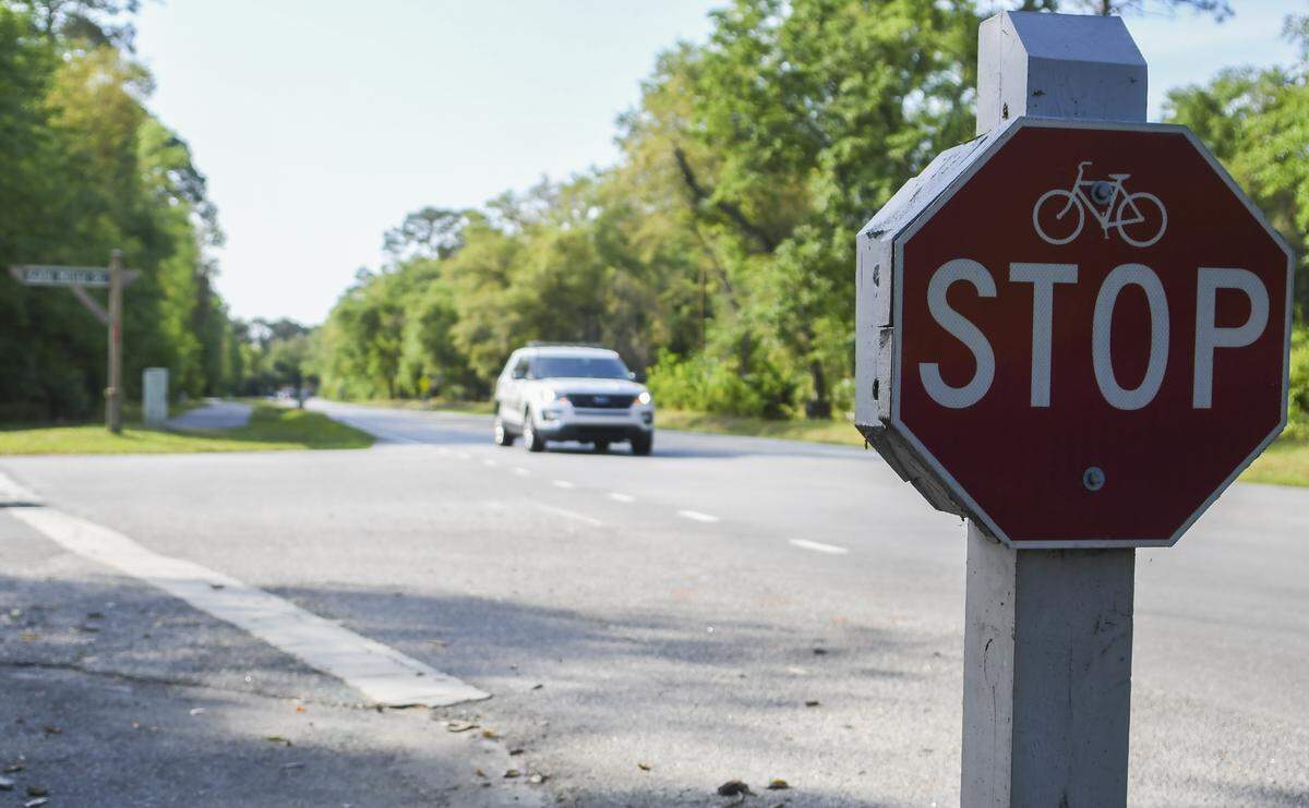 A Beaufort County Sheriff’s Deputy drives along Gum Tree Road at the intersection with Katie Miller Road on Tuesday, April 7, 2020 on Hilton Head Island.