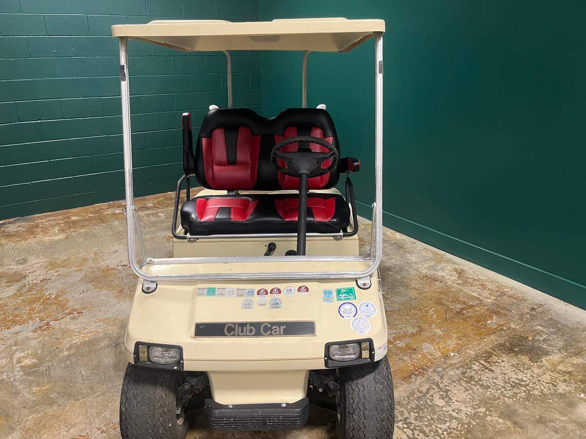 This classic golf cart will greet customers as they had to golf simulator bays at Egret and Iron in Beaufort.