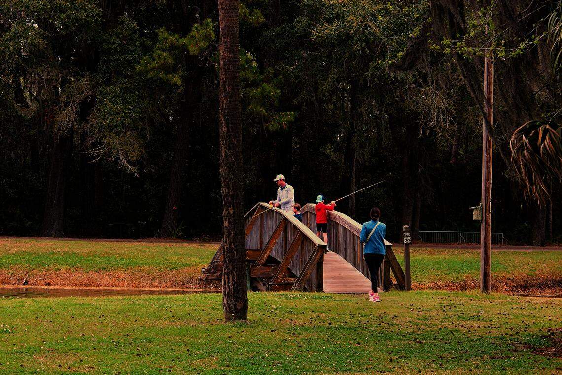 A family enjoys fishing on Fish Island, an idyllic picnic and fishing area in the Sea Pines Forest Preserve, on March 12, 2026. The Sea Pines Forest Preserve announced plans to transform the property into a “premier community amenity” but officials avoided questions about the project, saying it is in “early phases.”