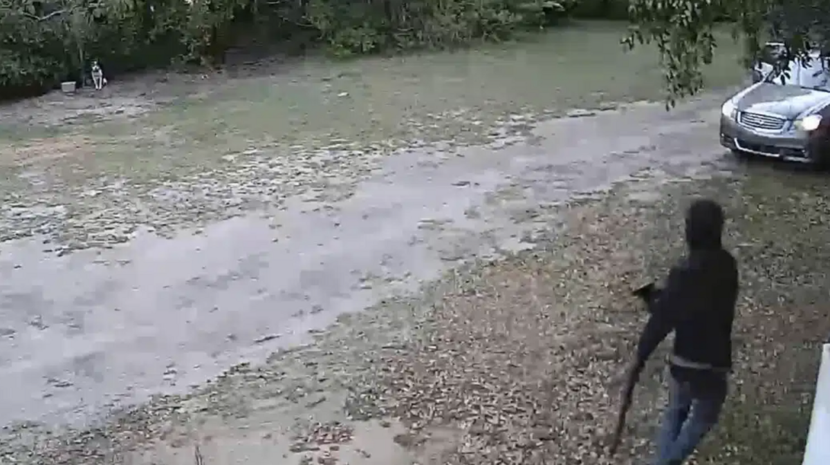 Surveillance video from the outside of a Burton home shows Jonas Jerry Washington, 25, leaving the residence with a long gun after robbing a couple at gunpoint in April 2021. Washington was one of two Beaufort men sentenced to prison Tuesday for the spur-of-the-moment armed robbery.