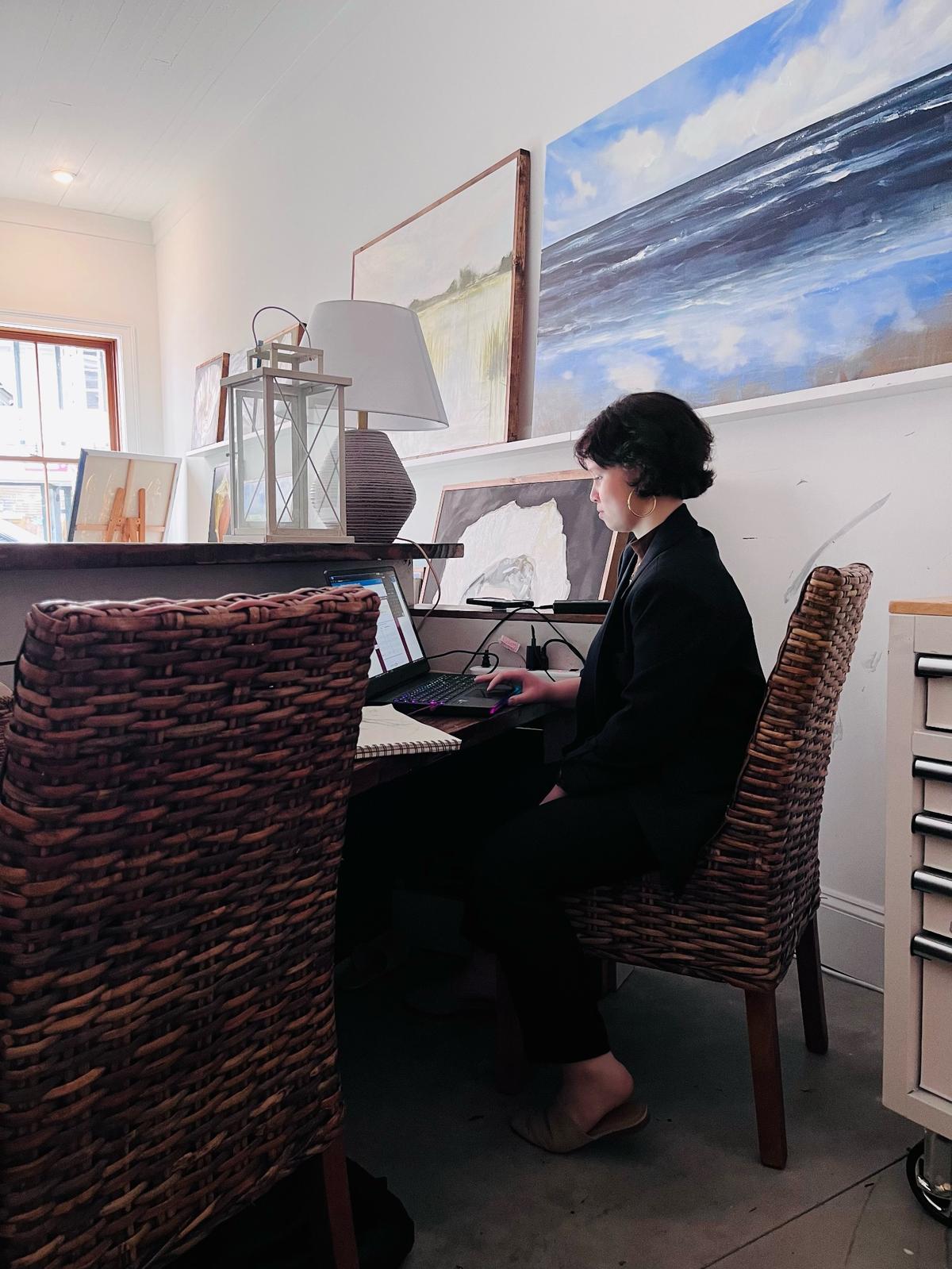 Beaufort County virtual student Grace Lyons does classwork in her mother’s Beaufort art shop.