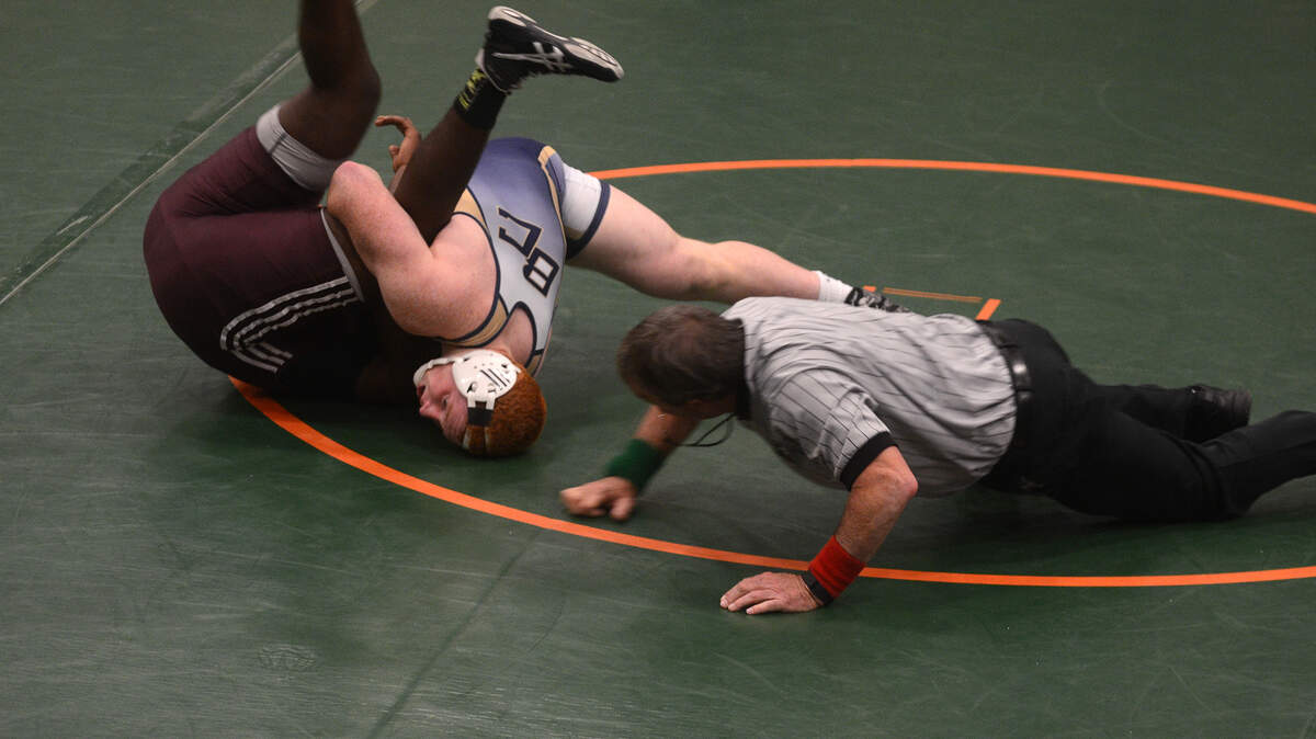 Battery Creek's Cooper Kaminsky tries to pin Marion's Malik Gaston during their match in the Class 2-A/1-A Lower State Wrestling Championship on Saturday afternoon at Battery Creek High School.